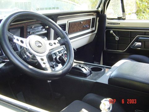 1989 Ford Bronco - The interior of a vehicle shows an aftermarket steering wheel and dashboard, with a date stamp of September 6, 2003.