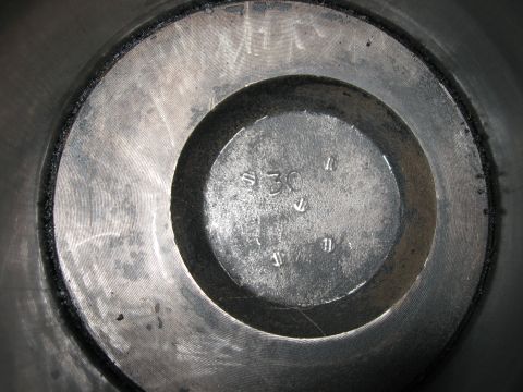 1981 Ford Bronco - A close-up view of an engine cylinder bore, showing stamped numbers and markings.