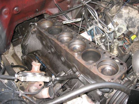 1981 Ford Bronco - Close-up view of an engine block, showing the cylinder bores and surrounding mechanical components.