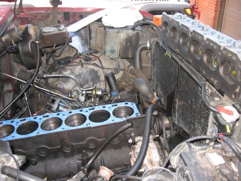 1981 Ford Bronco - Engine components are disassembled, showing the block and cylinder head removed from the engine.
