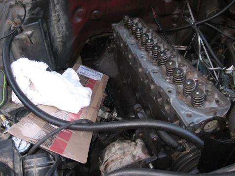 1981 Ford Bronco - Close-up view of an engine's cylinder head, showing internal components and a portion of the engine bay.