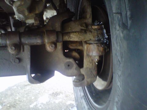 1994 Ford F-150 - This image shows a close-up view of a vehicle's suspension system, focusing on mechanical components.