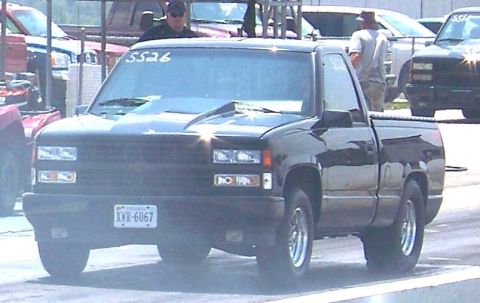 1990 Chevrolet Silverado 1500 - This 1990 Chevrolet Silverado 1500 pickup truck is viewed from the front at what appears to be a drag racing event.
