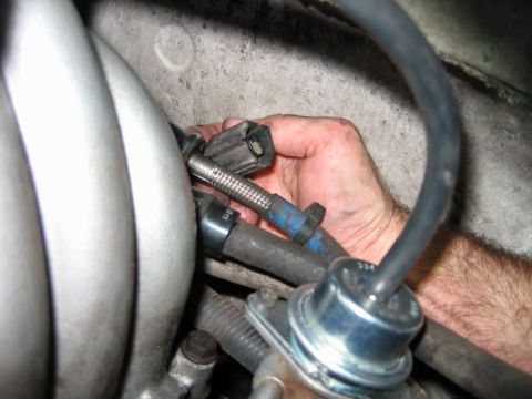 1992 Ford Bronco - Disconnecting a fuel line connector during engine maintenance.