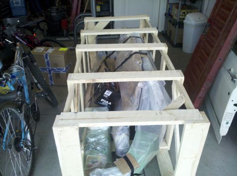 1995 Ford Bronco - Vehicle parts are crated for transport, with a PIAA 640 item visible inside.
