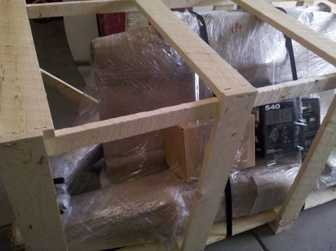 1995 Ford Bronco - Items are secured within a wooden crate for transport or storage.