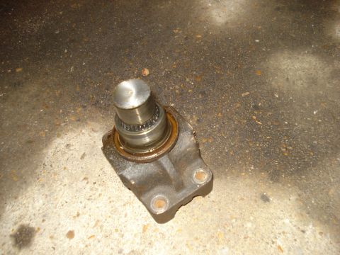 1985 Ford Bronco - A close-up view of a worn wheel bearing hub assembly, likely removed from a vehicle for repair.