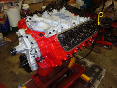 1989 Ford Bronco - A V8 engine is assembled on a stand, showing internal components like the valve train.