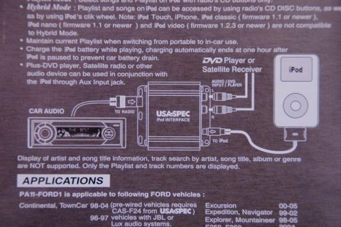 2003 Ford Taurus - This diagram illustrates the USA-SPEC iPod interface kit, detailing its connections to car audio systems and an iPod.