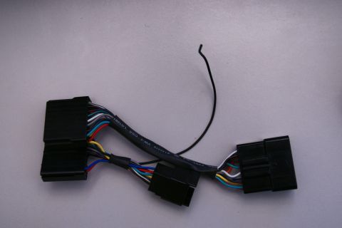 2003 Ford Taurus - A wiring harness with multiple connectors and colored wires is shown against a plain background.