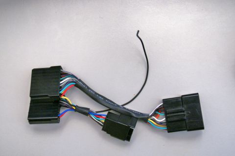 2003 Ford Taurus - Wiring harness with multiple connectors and colored wires, text visible on cable.