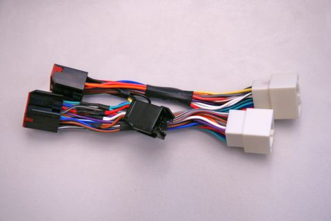 2003 Ford Taurus - This wiring harness adapter features multiple colored wires and black connectors, designed for specific vehicle audio system integrations.