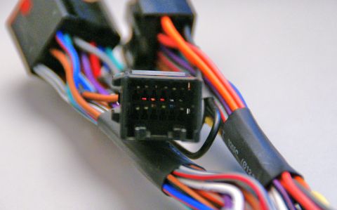 2003 Ford Taurus - Close-up of a multi-pin electrical connector with various colored wires.