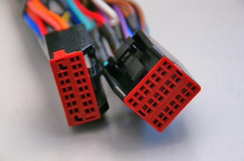 2003 Ford Taurus - Close-up of two automotive wiring harness connectors, each with multiple pins.