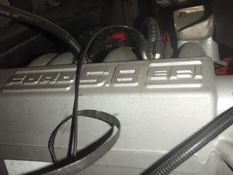 Ford 5.8L engine valve cover with hoses