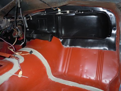 1972 Chevrolet Camaro - Interior view of a car's floor and dashboard, revealing exposed wiring and HVAC components.