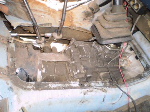 1978 Ford Bronco - Manual transmission and transfer case components visible inside a vehicle's cabin.