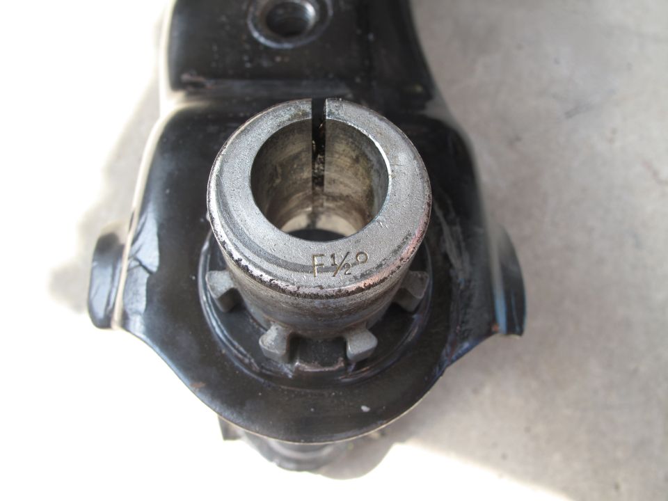 Close-up of a metal part with F 1/2 stamped on it
