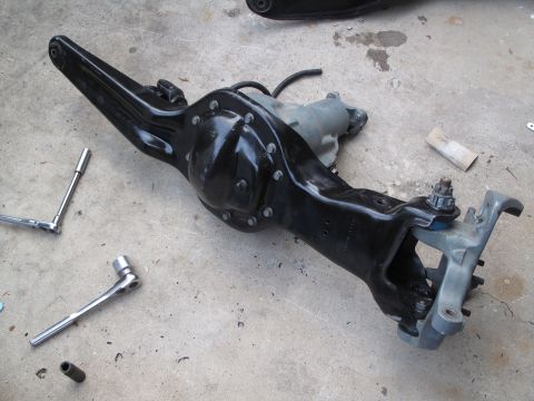 1995 Ford Bronco - Rear axle assembly removed from a vehicle, likely for repair or modification.