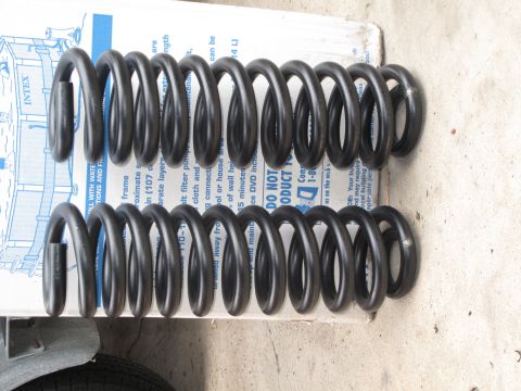 1995 Ford Bronco - Coil springs are shown on a box with text, suggesting they are automotive parts.