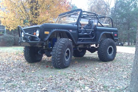1967 Ford Mustang - This modified Ford Bronco features a roll cage and oversized tires, suggesting off-road capabilities.