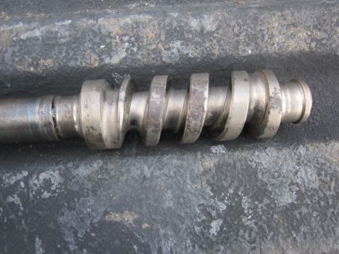 1979 Ford Bronco - Close-up of a metal worm gear shaft, likely a mechanical component.