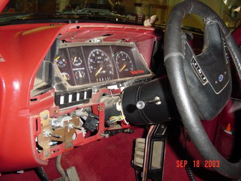 1989 Ford Bronco - The interior of a vehicle shows a disassembled dashboard with exposed wiring and gauges, dated September 18, 2003.