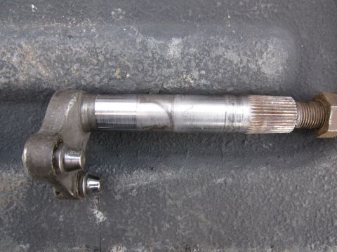 1979 Ford Bronco - Close-up of a metal steering linkage component, showing splines and a securing nut.