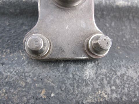 1979 Ford Bronco - Metal bracket with two bolts, possibly a vehicle part.