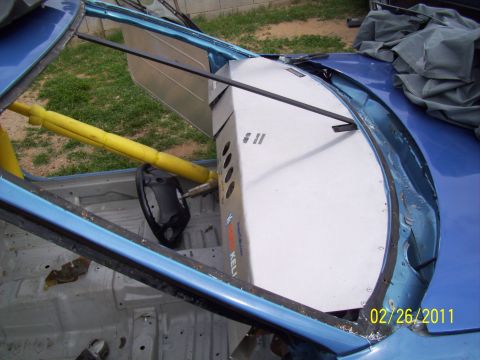 1995 Ford Probe - Custom interior panel and roll cage installed in a blue vehicle.