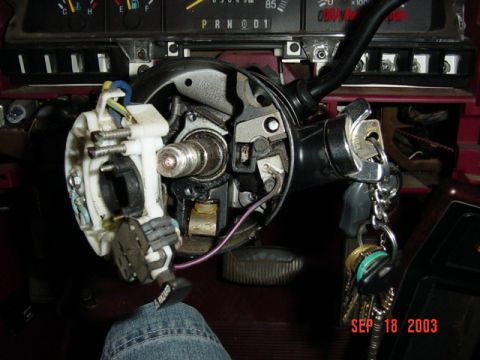 1989 Ford Bronco - The ignition switch assembly and keys are shown in the vehicle's interior.