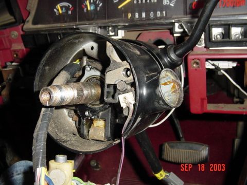1989 Ford Bronco - The interior of a 1989 Ford Bronco shows the steering column and dashboard with visible date stamp.