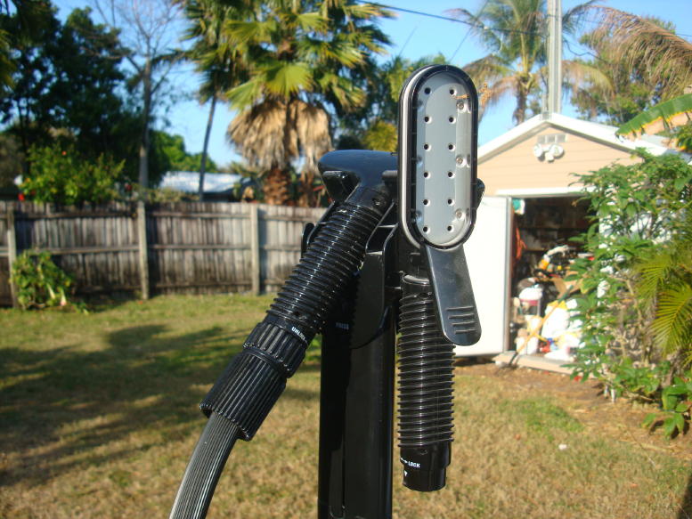 Steam cleaner part with ribbed handle and metal plate with holes