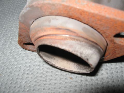 1994 Ford Bronco - This is a close-up view of a rusty exhaust pipe flange.