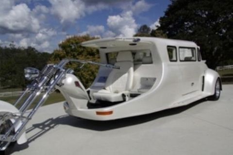 1981 Ford Bronco - A unique white vehicle combines a motorcycle front with a limousine-style passenger compartment.