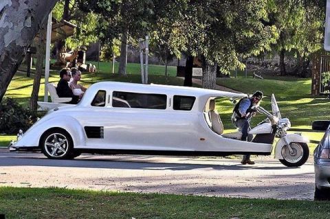 1981 Ford Bronco - This unique custom vehicle combines a limousine body with a motorcycle front end, open rear seating and a driver on the motorcycle.