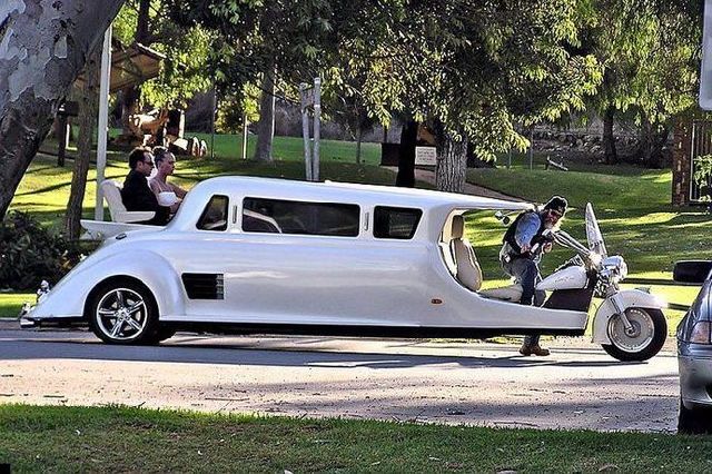 White custom limousine with motorcycle front and open rear seating