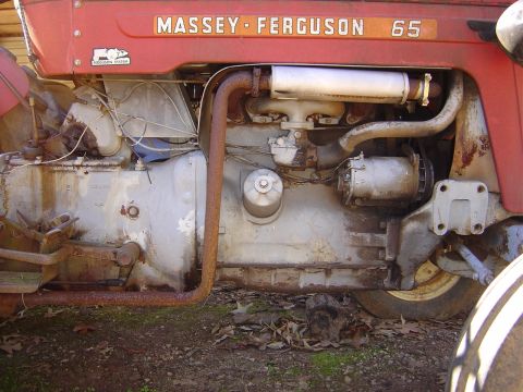 1986 Ford Bronco - Close-up view of the engine compartment on a Massey-Ferguson 65 tractor.