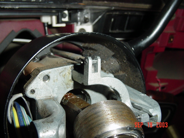 Disassembled steering column with ignition switch parts and wiring