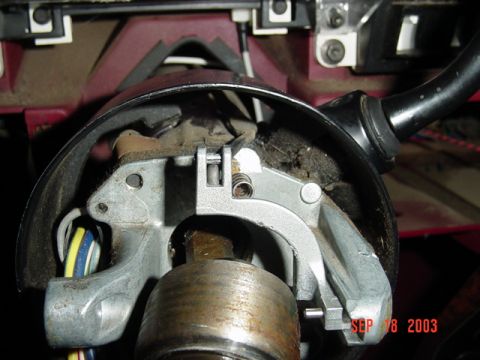 1989 Ford Bronco - The ignition switch assembly in a vehicle's steering column is shown, with wiring and mechanical components visible.