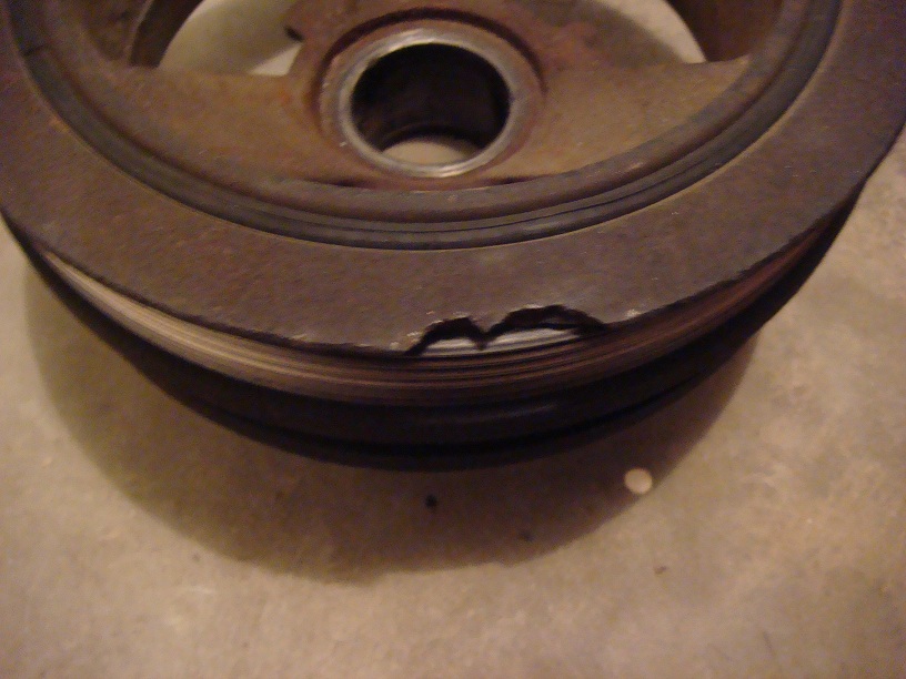 Damaged crankshaft pulley with chipped edges