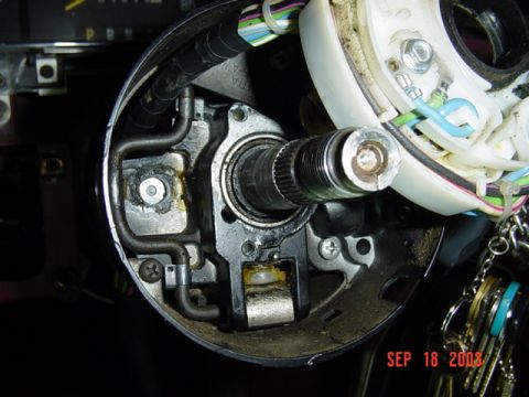1989 Ford Bronco - The interior of a vehicle's steering column shows mechanical components and wiring, with a date stamp of SEP 18 2003.