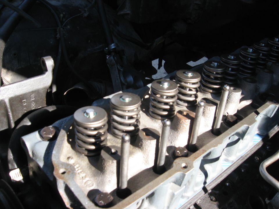 engine valve springs and pushrods on a cylinder head