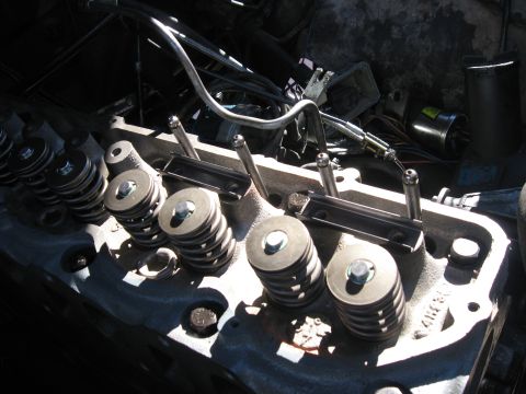 1981 Ford Bronco - Close-up view of an engine's cylinder head, showing valve springs and pushrods.