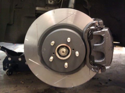 2006 Subaru Legacy - This image shows a close-up view of a vehicle's brake system, including the rotor and caliper.