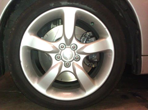 2006 Subaru Legacy - Close-up of a car's wheel and brake system.