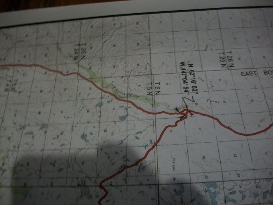 Topographic map showing a red route line with coordinates N 62°16'02" W.147°04'54"