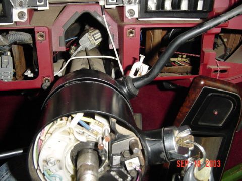 1989 Ford Bronco - The interior of a 1989 Ford Bronco reveals exposed wiring and components around the steering column.