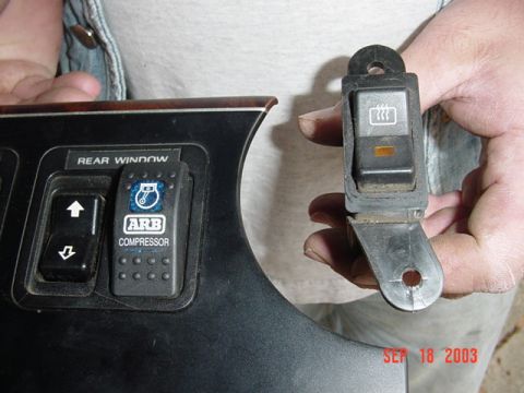 1989 Ford Bronco - Interior dashboard panel with an ARB compressor switch and a rear window switch is shown.