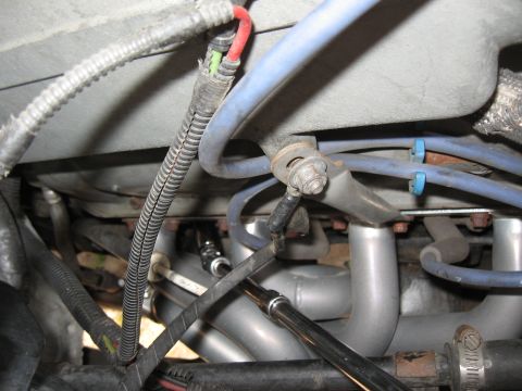 1994 Ford Bronco - Detail of engine components, including exhaust headers and various wires and hoses.